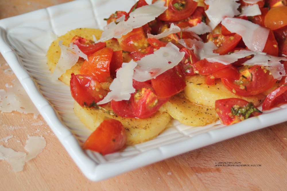 Sweet, tangy cherry tomatoes are roasted and served over grilled polenta. 